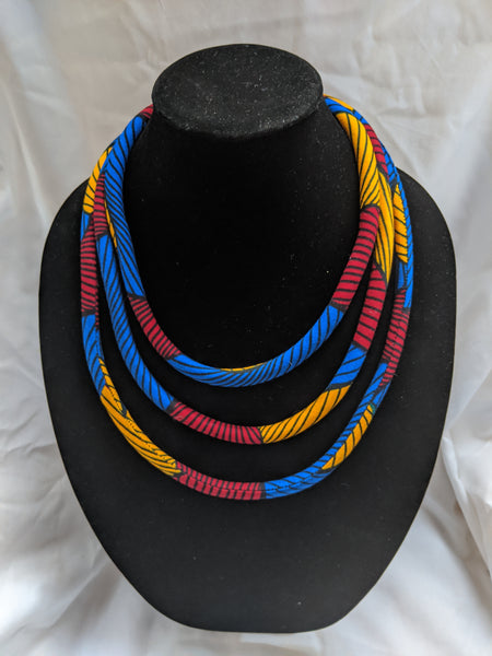 Blue red gold yellow black African Print Ankara cotton Fabric material magnetic tri-layer necklace. Matching earrings, bracelets and clutch bag sold separately. 