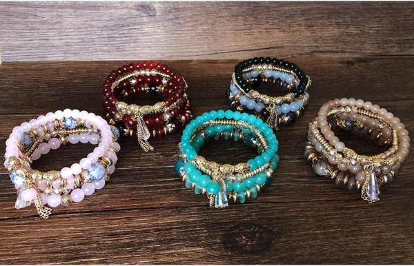 4-piece set Bohemian Heart or Crystal Resin Beads Stone Bracelets. Elastic band fits most wrists, each set sold separately. 
