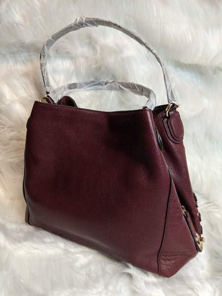 Authentic Coach handbag (back side) is 100% genuine leather. 