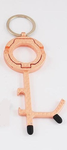 6-in-1 No Touch Multiple Use rose-gold Keychain. Can be used to open doors, bottle opener, cell phone stand, press key pads and elevator buttons, scroll on cell phone and keys holder.