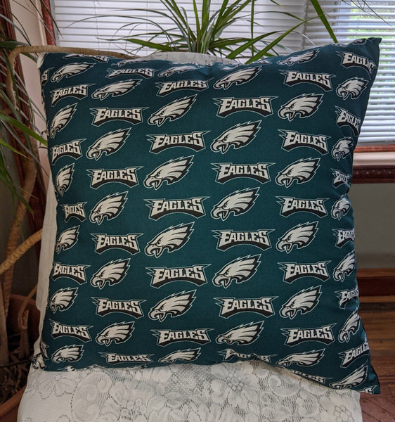 NFL design on one side and plain color on other side, 100% cotton. Measurements: 18 inches long and 18 inches wide