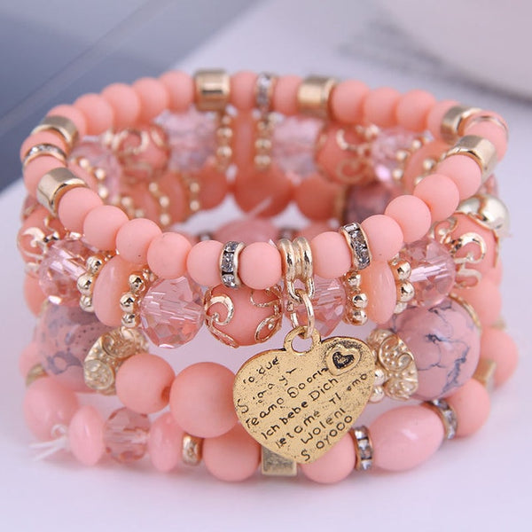 4-piece set Bohemian Heart or Crystal Resin Beads Stone Bracelets. Elastic band fits most wrists.