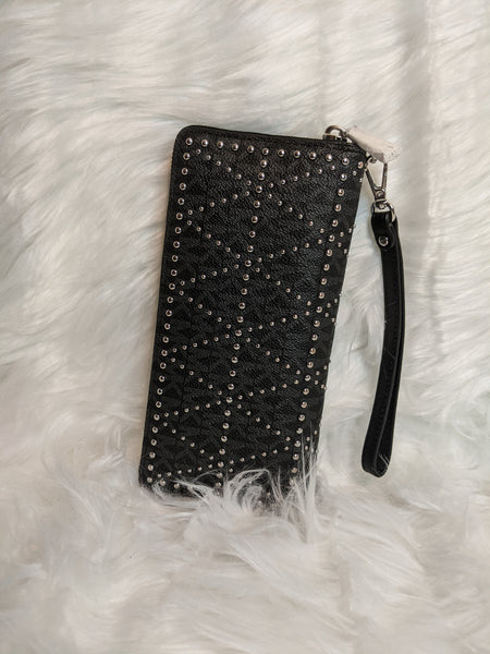 Authentic Michael Kors wallet (back) is  100% genuine leather