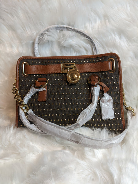 Authentic Michael Kors handbag is 100% genuine leather. 