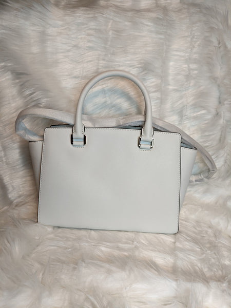 Authentic Michael Kors handbag (back side) is 100% genuine leather. 